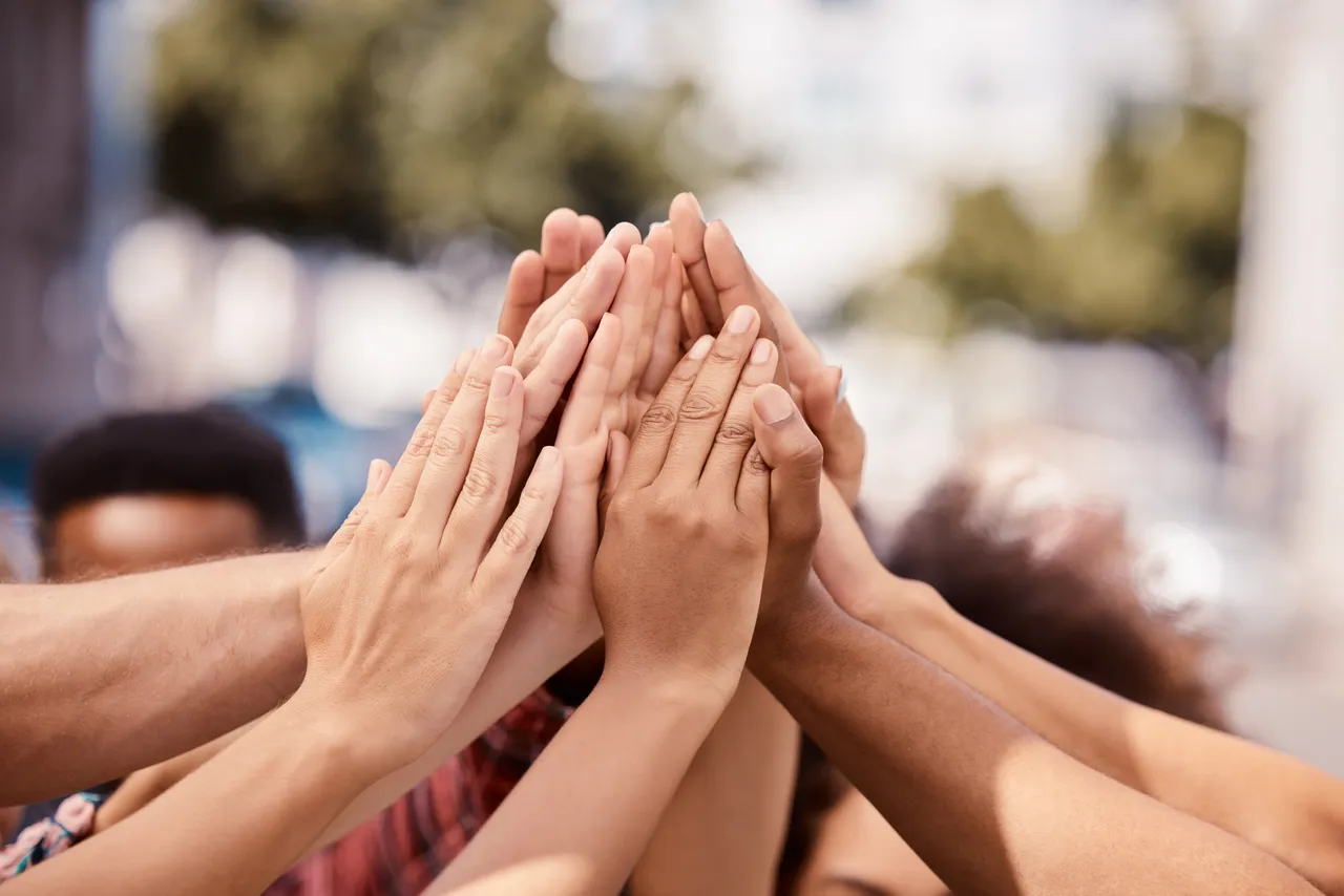 People joining hands together